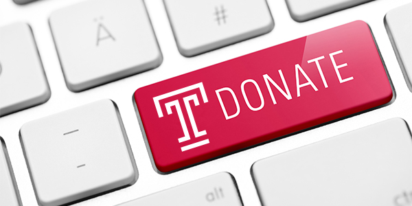 Illustration of a computer key reading “Donate,” with a Temple T.