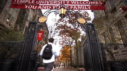 Video shots of students walking and of the Philadelphia skyline beyond campus.