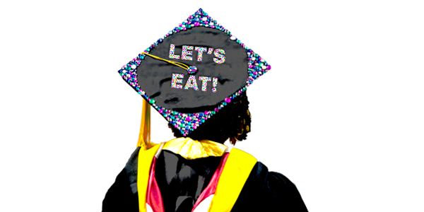 A graduation cap with the words, “let’s eat.”