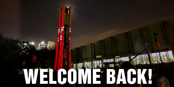Animated picture of fireworks, a bell tower and text reading “welcome back.”