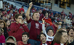 Bill DeSio cheering in the stands at a Temple football game. 