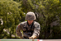 ROTC student in fatigues rappelling off a building on Temple’s campus 
