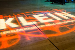 Klein College’s logo projected onto a stageKlein College’s logo projected onto a stage