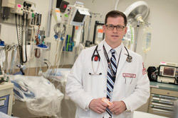 Joseph D’Orazio holding naloxone in a trauma bay at Temple Hospital. 