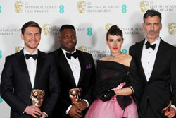 Four men and a woman holding British Academy of Film and Television Arts awards.