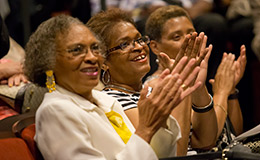 Three women clapping at the 20 Year Club ceremony.