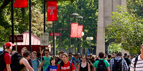 Students walking past the bell tower on Main Campus.