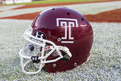 A football helmet in the end zone before a game.
