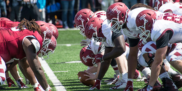 Temple football facing off as the cherry and white teams.