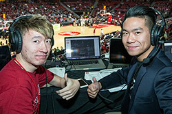 James and Javi Yuan broadcasting in the press box in the Liacouras Center.