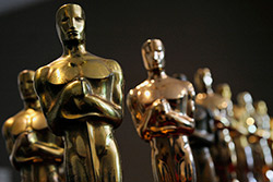 Several Oscar statuettes.