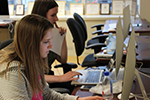 Student-journalists using computers in the Philadelphia Neighborhoods newsroom