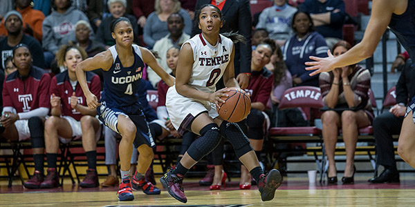 A women’s basketball player taking a shot in McGonigle Hall.